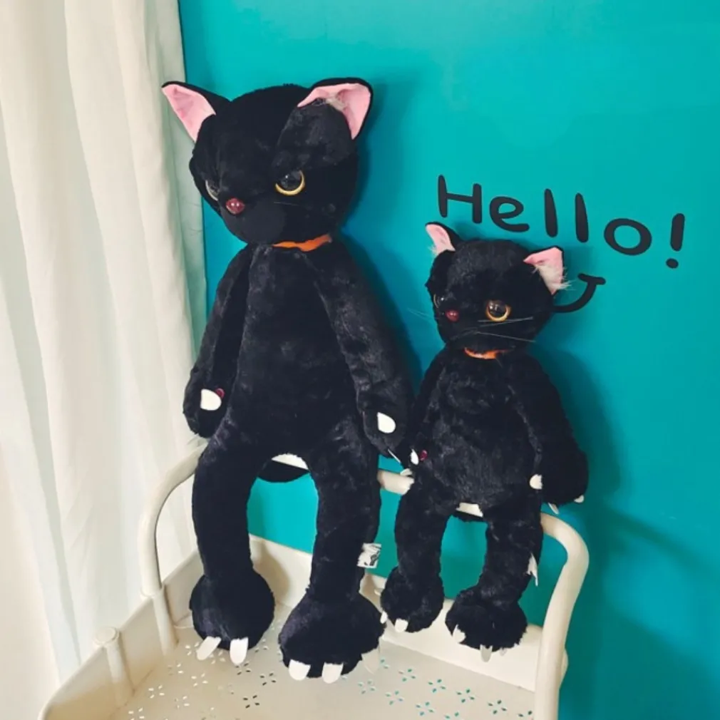 Peluche chat noir mécontent assis