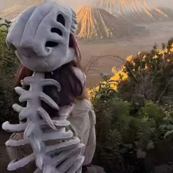 Peluche déguisement squelette de dinosaure