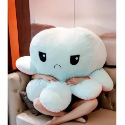 Peluche géante pieuvre réversible visage content et pas content