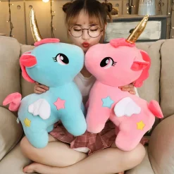 Peluche licorne rose de corne dorée