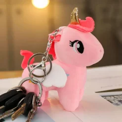 Peluche licorne rose de corne dorée