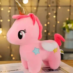 Peluche licorne rose de corne dorée