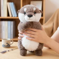 Peluche loutre câline aux pattes aimantées