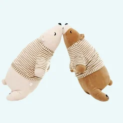 Peluche ours blanc habillé qui dort