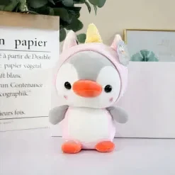 Peluche pingouin déguisé en licorne