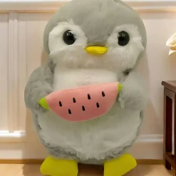Peluche pingouin qui respire avec berceuses intégrées