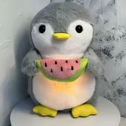 Peluche pingouin qui respire avec berceuses intégrées