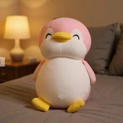 Peluche pingouin rose souriant