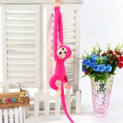 Peluche singe kawaii longue queue fushia
