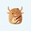 Peluche Squishmallow taureau avec guitare