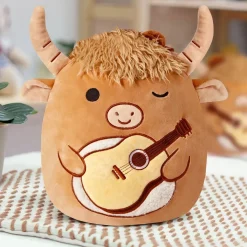 Peluche Squishmallow taureau avec guitare