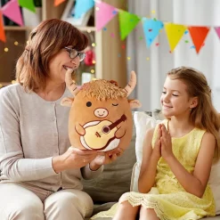 Peluche Squishmallow taureau avec guitare