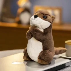 Petite peluche loutre en prière