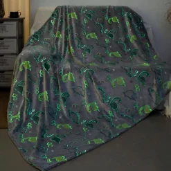 Plaid lumineux en forme de dinosaure